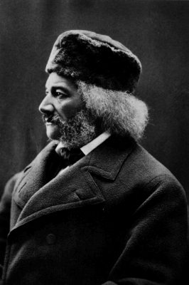 Image of Douglass in winter clothing looking left