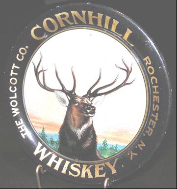Image of Wolcott Distillery serving tray with Cornhill Whiskey and picture of an elk