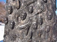 Close up picture of the 'seat of forgetting and remembering' sculpture showing the faces