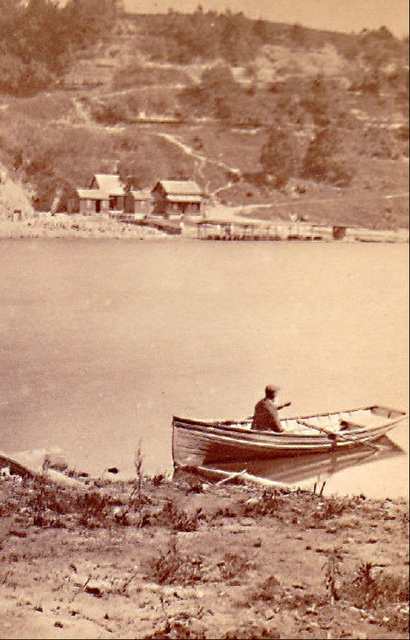 Picture of man in rowboat looking at Carthage