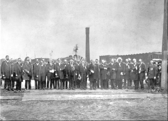 Picture of a group of dignitaries at the location of the Eastman Memorial