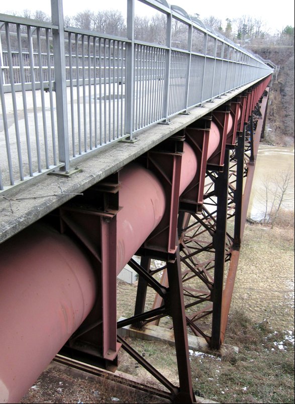 Picture of a walkway built over large pipes