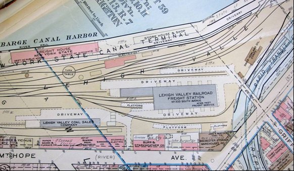 Picture of NYS Barge Canal terminal and south entrance to new trolley and fright subway system.  Looking south on Genesee river, Rochester, NY